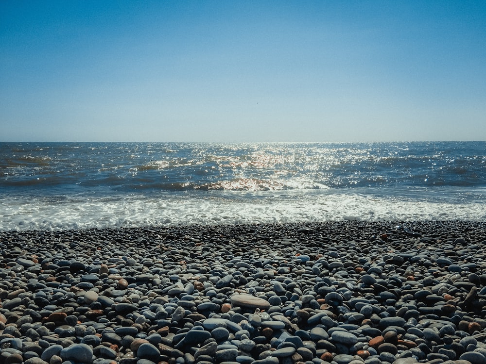 a rocky beach with waves crashing