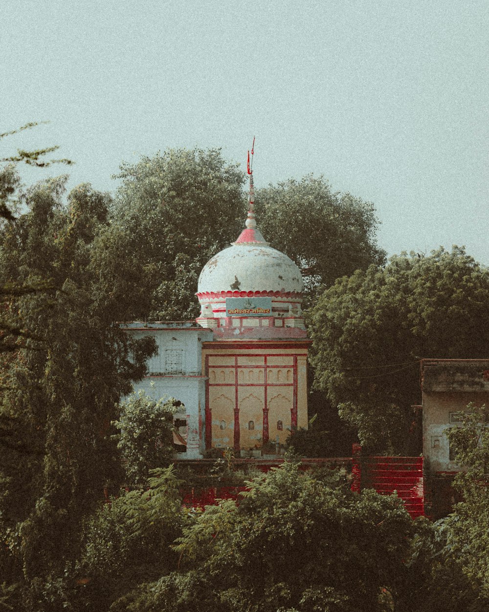 a building with a dome and a flag on top