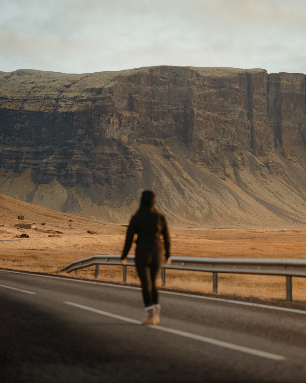 a man walking on a road