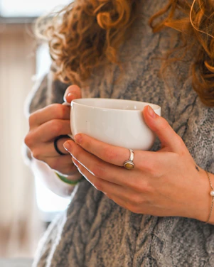 a person holding a cup