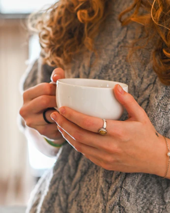 a person holding a cup