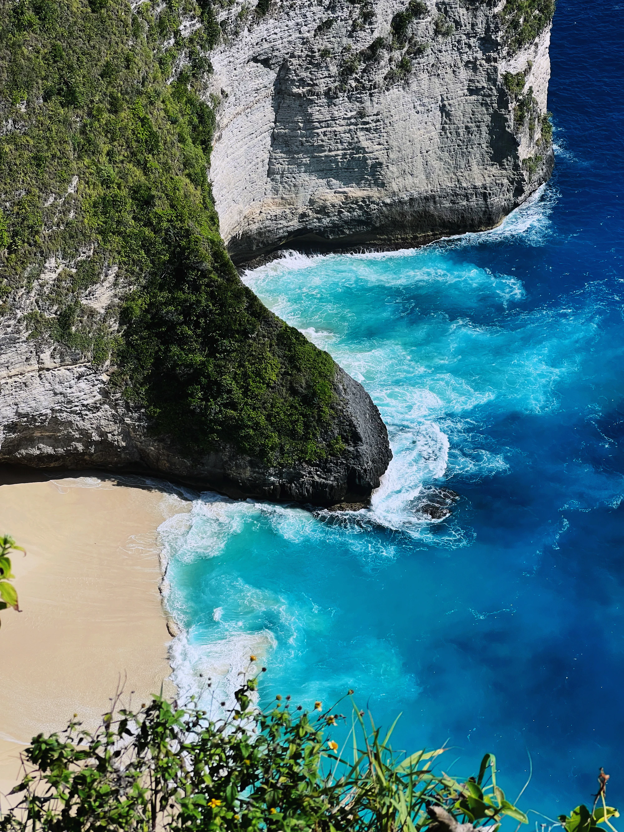 Rocky coastal enclosure and blue water on Nusa Penida