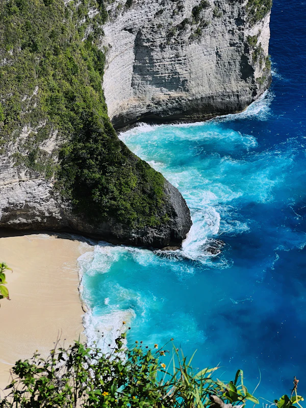 Rocky coastal enclosure and blue water on Nusa Penida