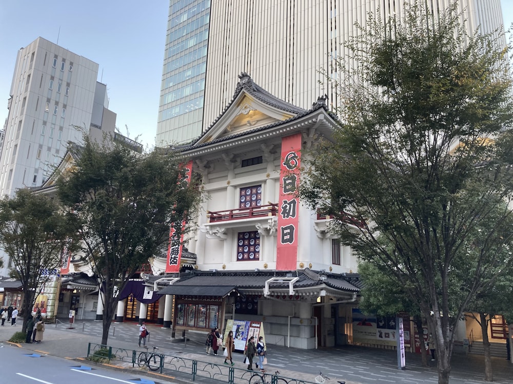 a street with trees and buildings on the side