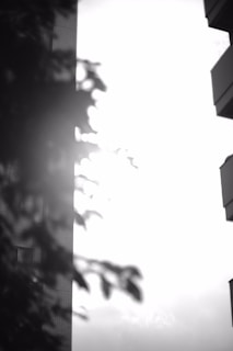 A high-contrast still from a commercial featuring sharp lines and deep shadows on urban architecture.