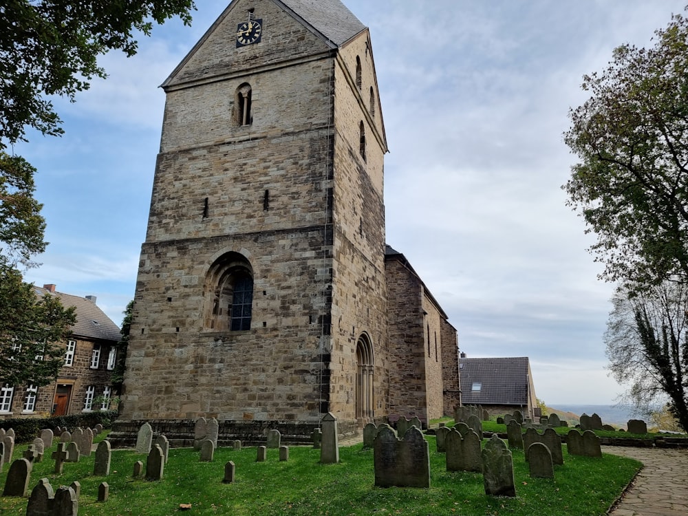 a stone church with a graveyard