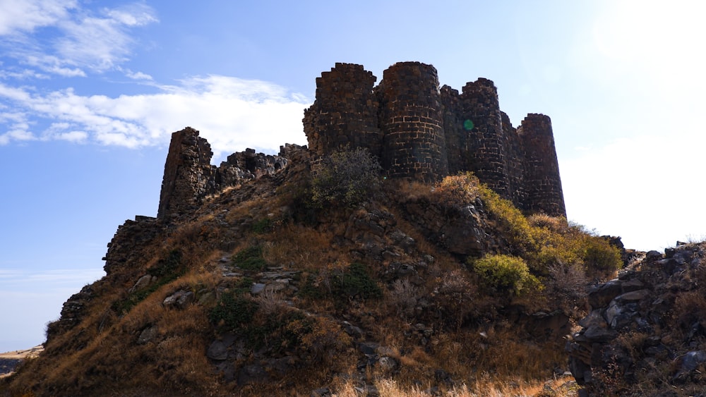 a stone castle on a hill