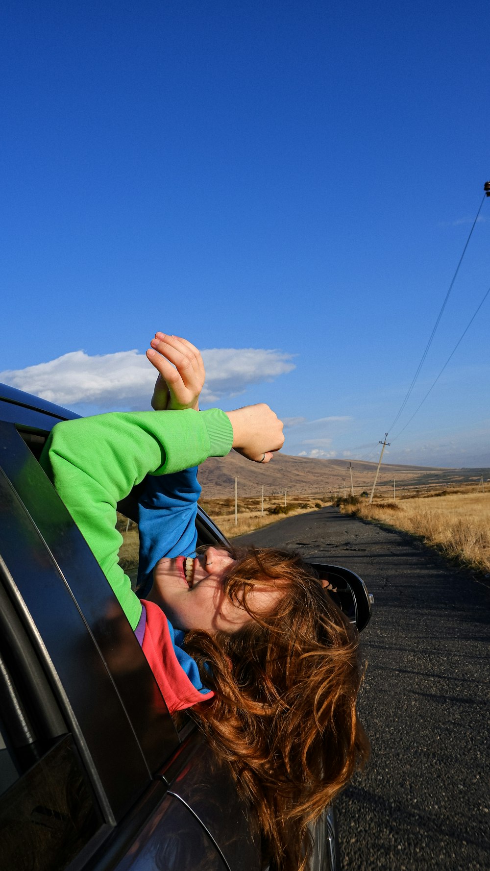 a man holding a baby on a car