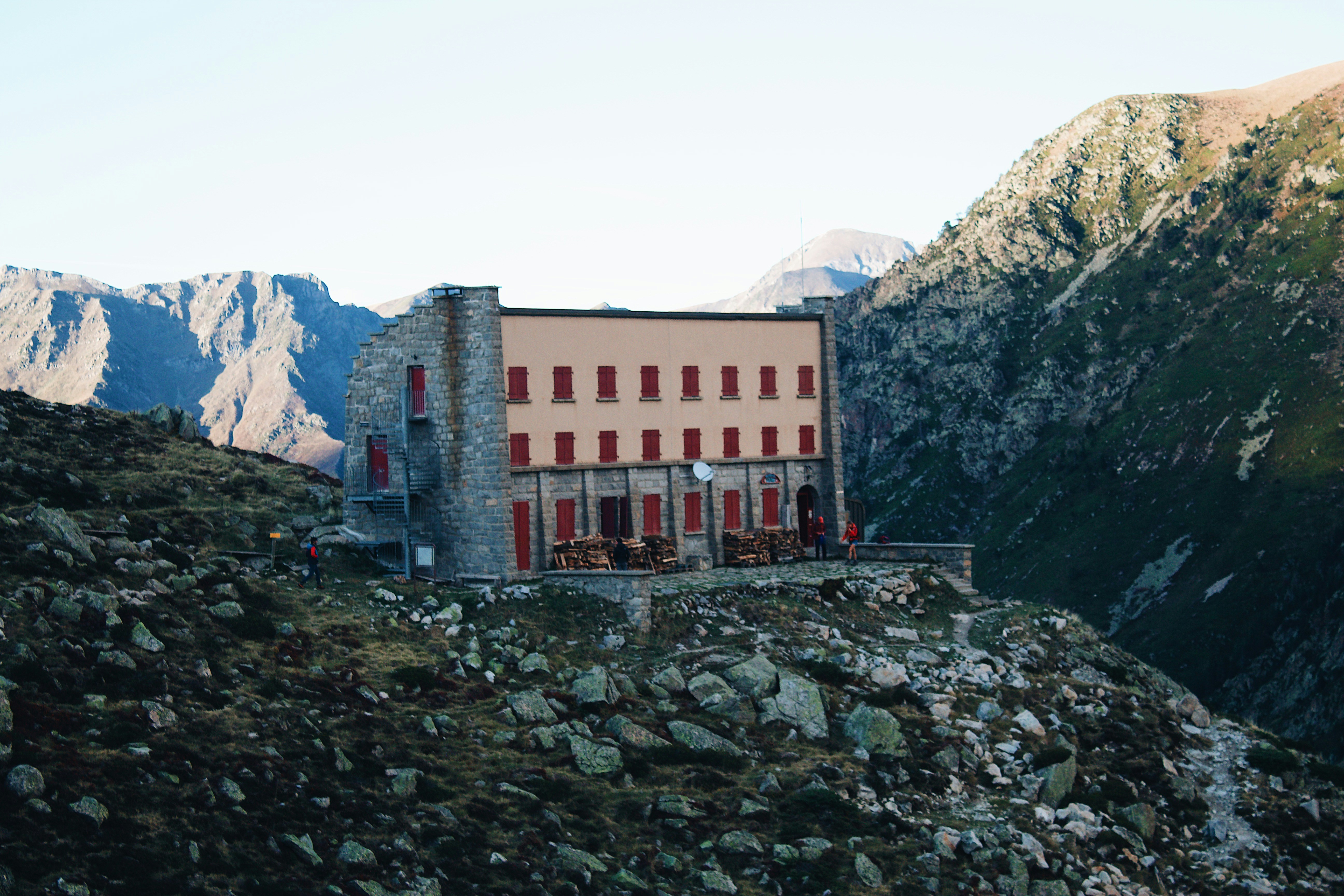 A building on a rocky hill photo – Free Pyrenees Image on Unsplash