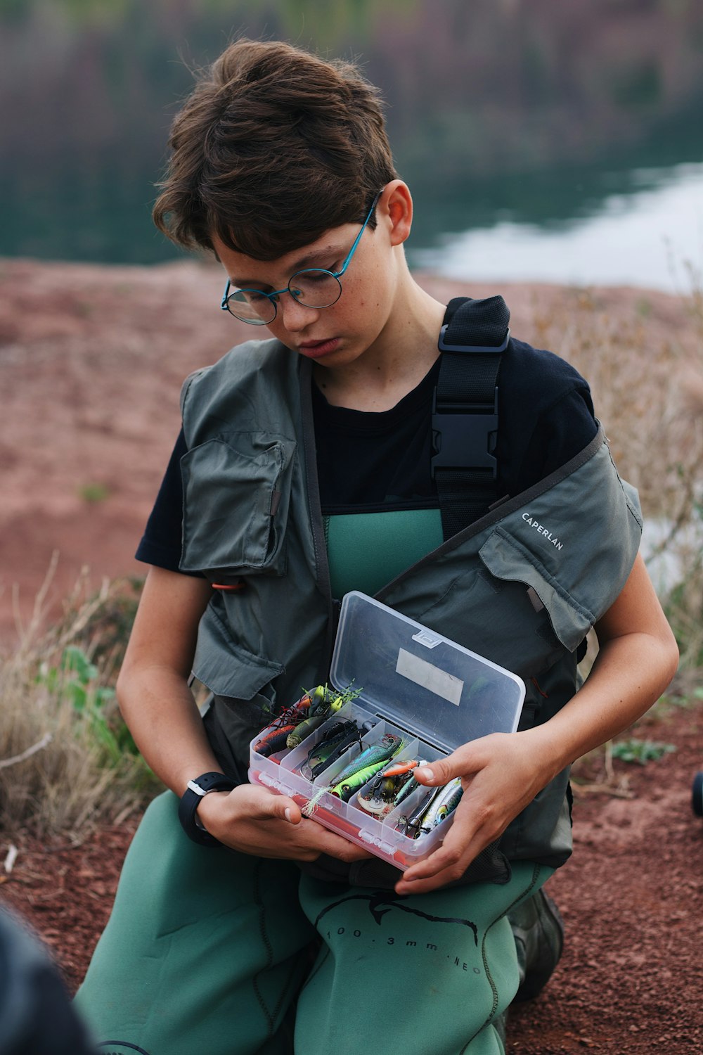 a person holding a box of candy