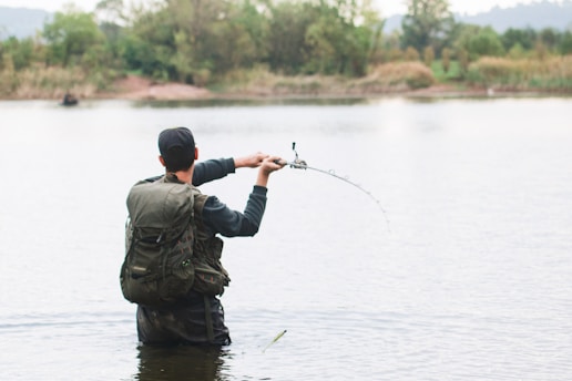 a man fishing in a lake