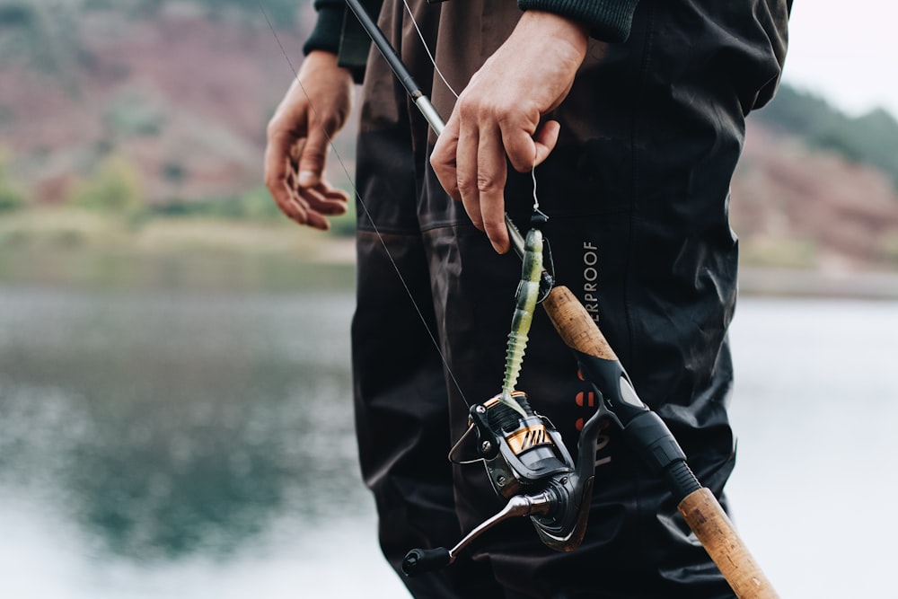 a man holding a fishing pole