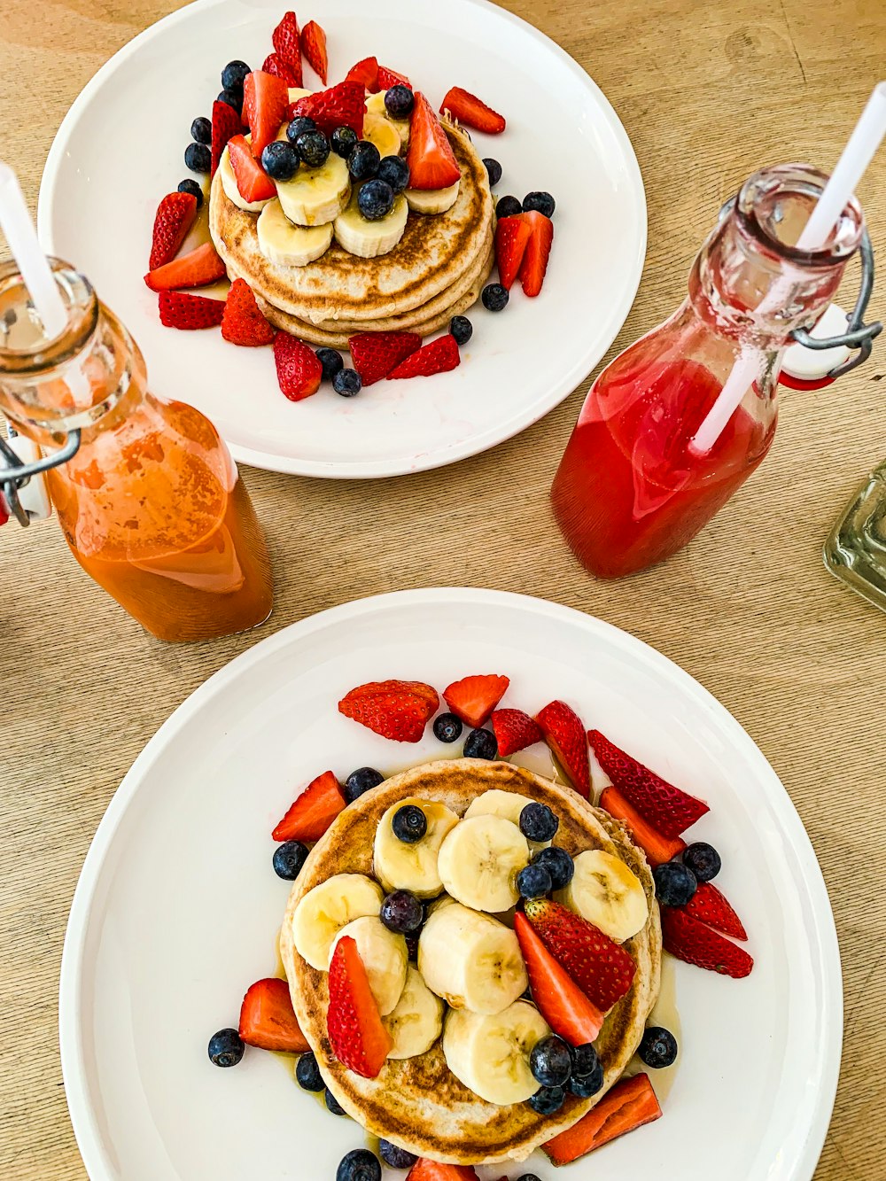 a couple of plates with fruit on them