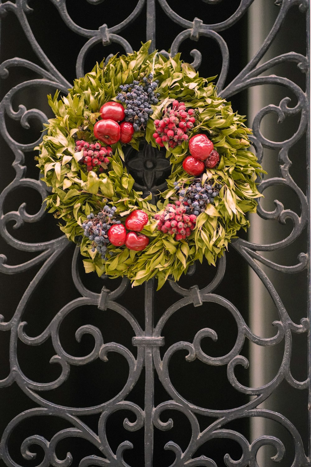 a bouquet of flowers on a metal fence