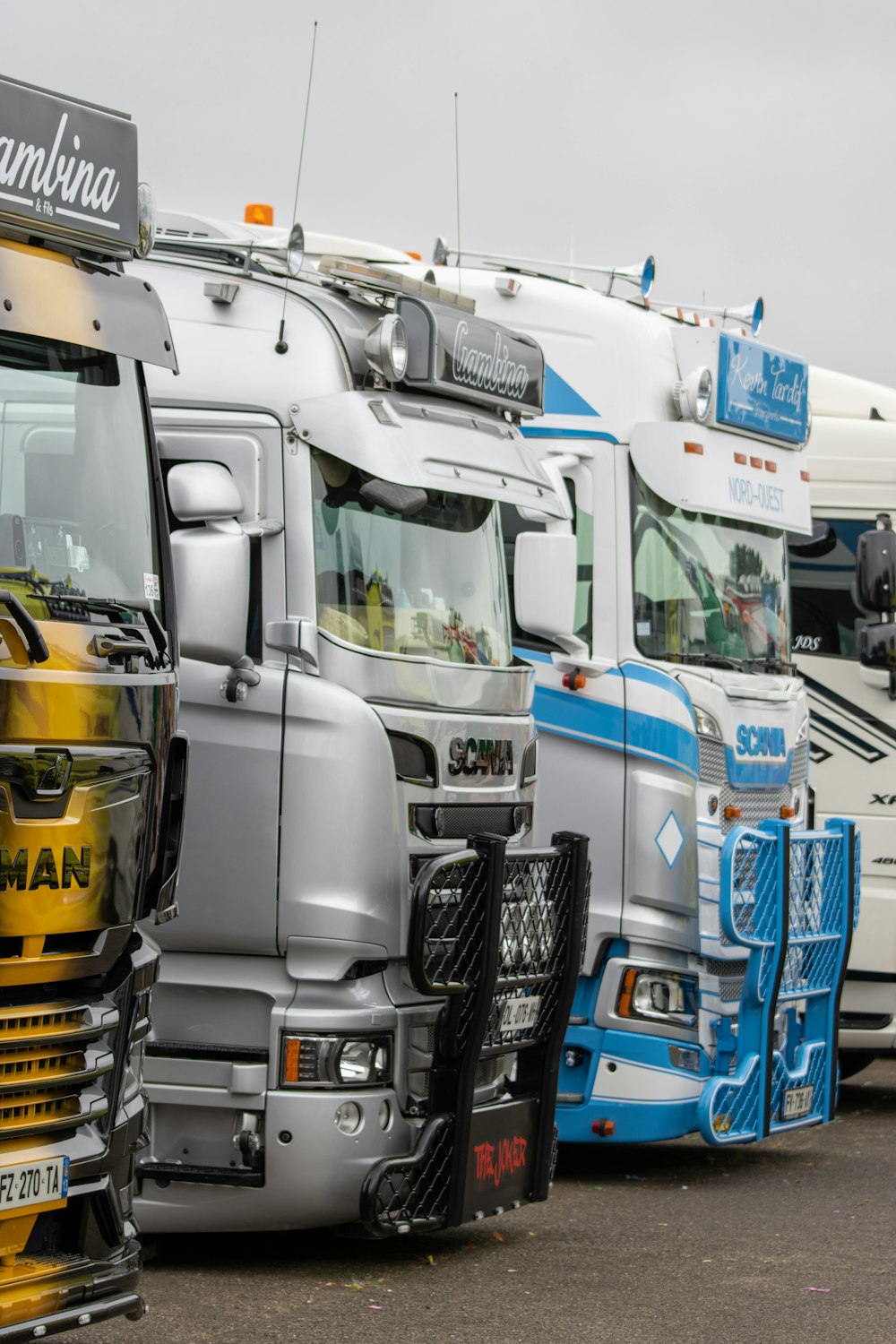 a group of trucks are parked