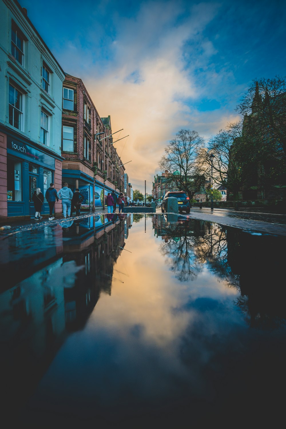 a canal with a bus and buildings