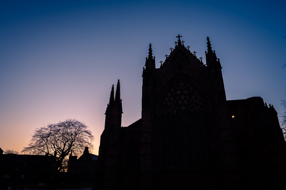 silhouette of a building at sunset