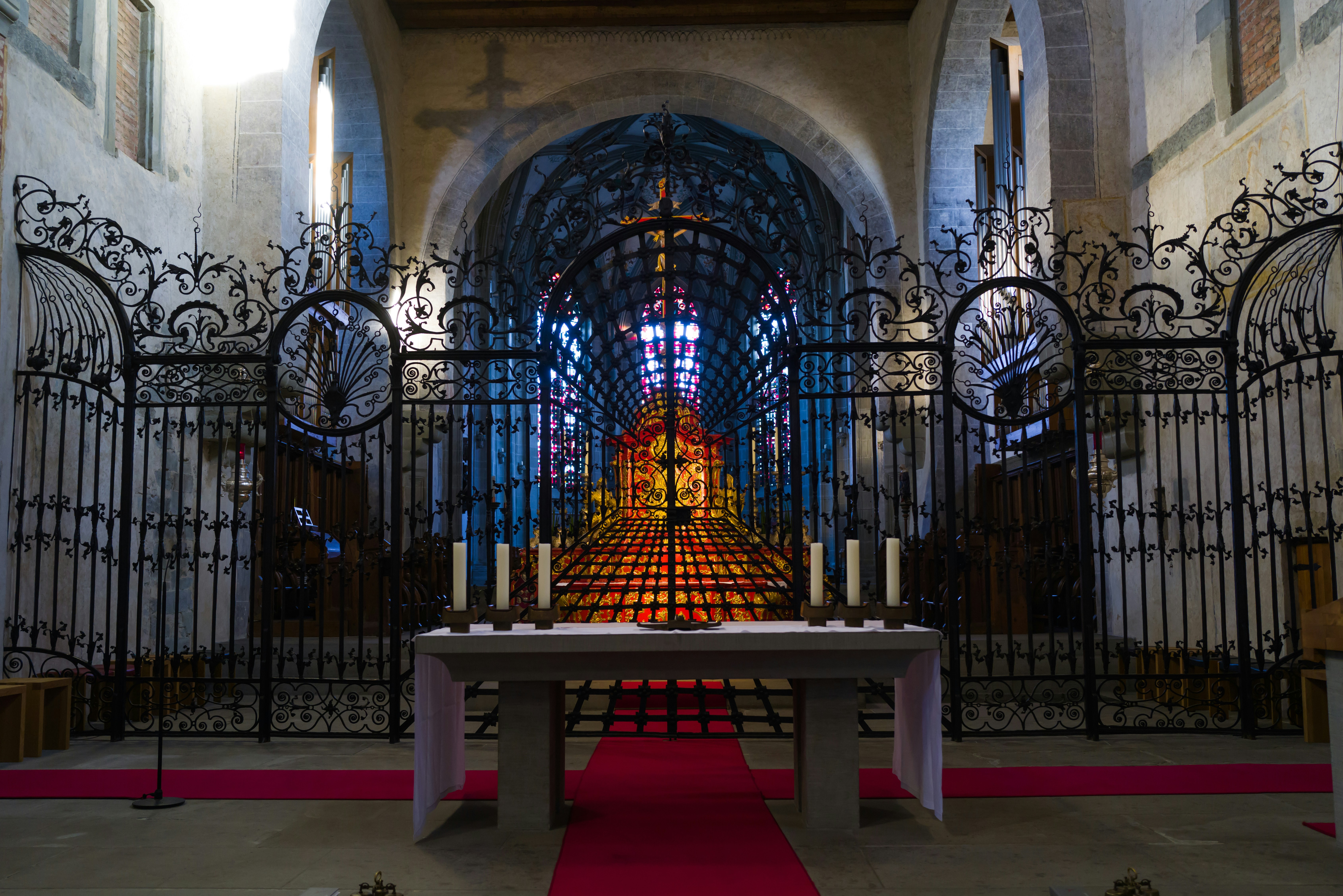 a large ornate building with a red light in the center