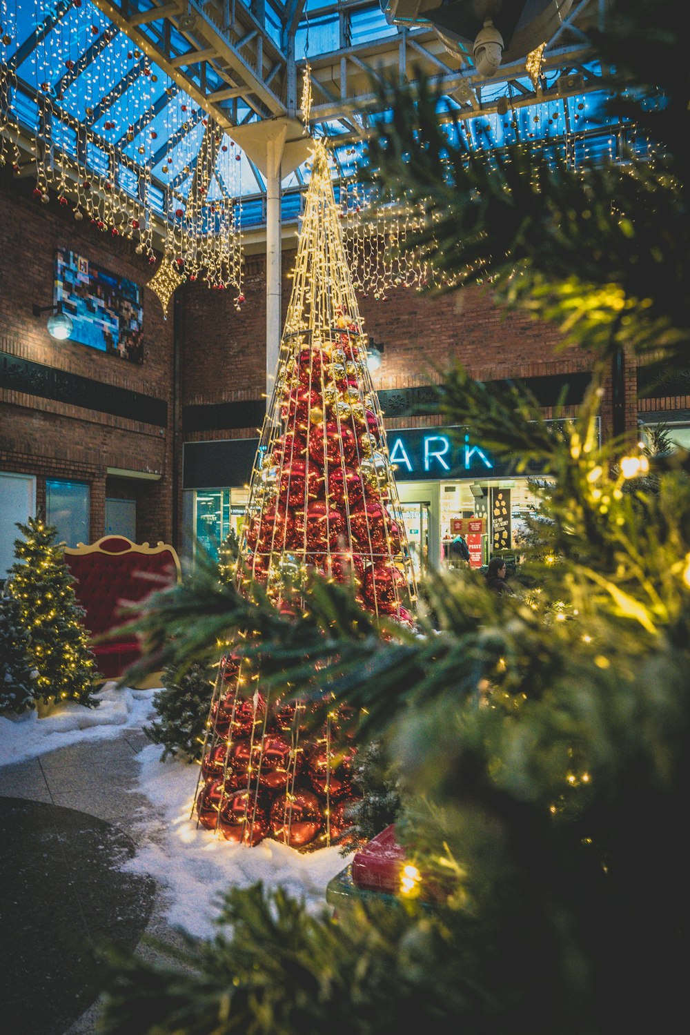 a christmas tree outside a building