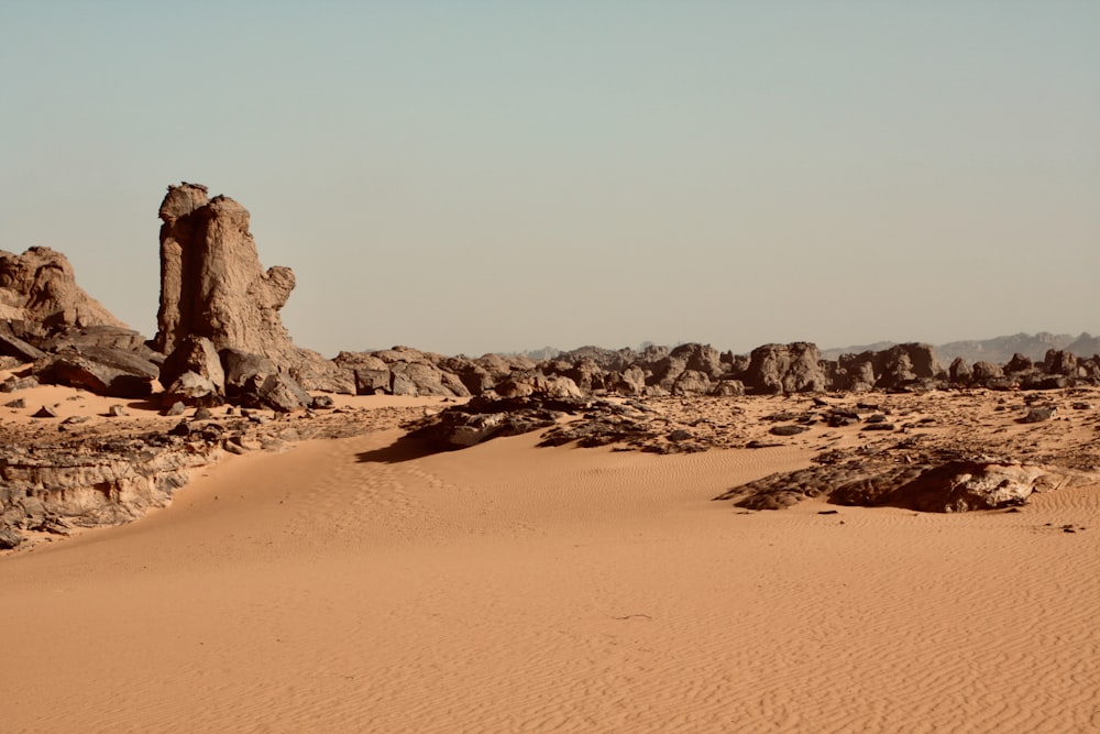 a desert landscape with a few large rocks