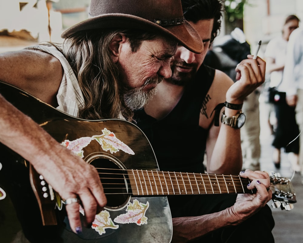 a man playing a guitar