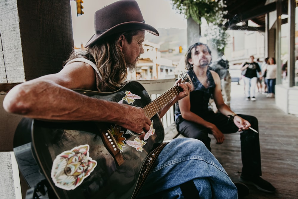 a man playing a guitar