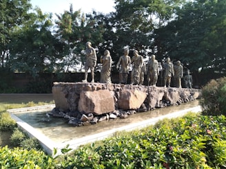 a group of statues in a garden