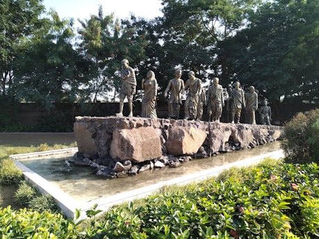 a group of statues in a garden