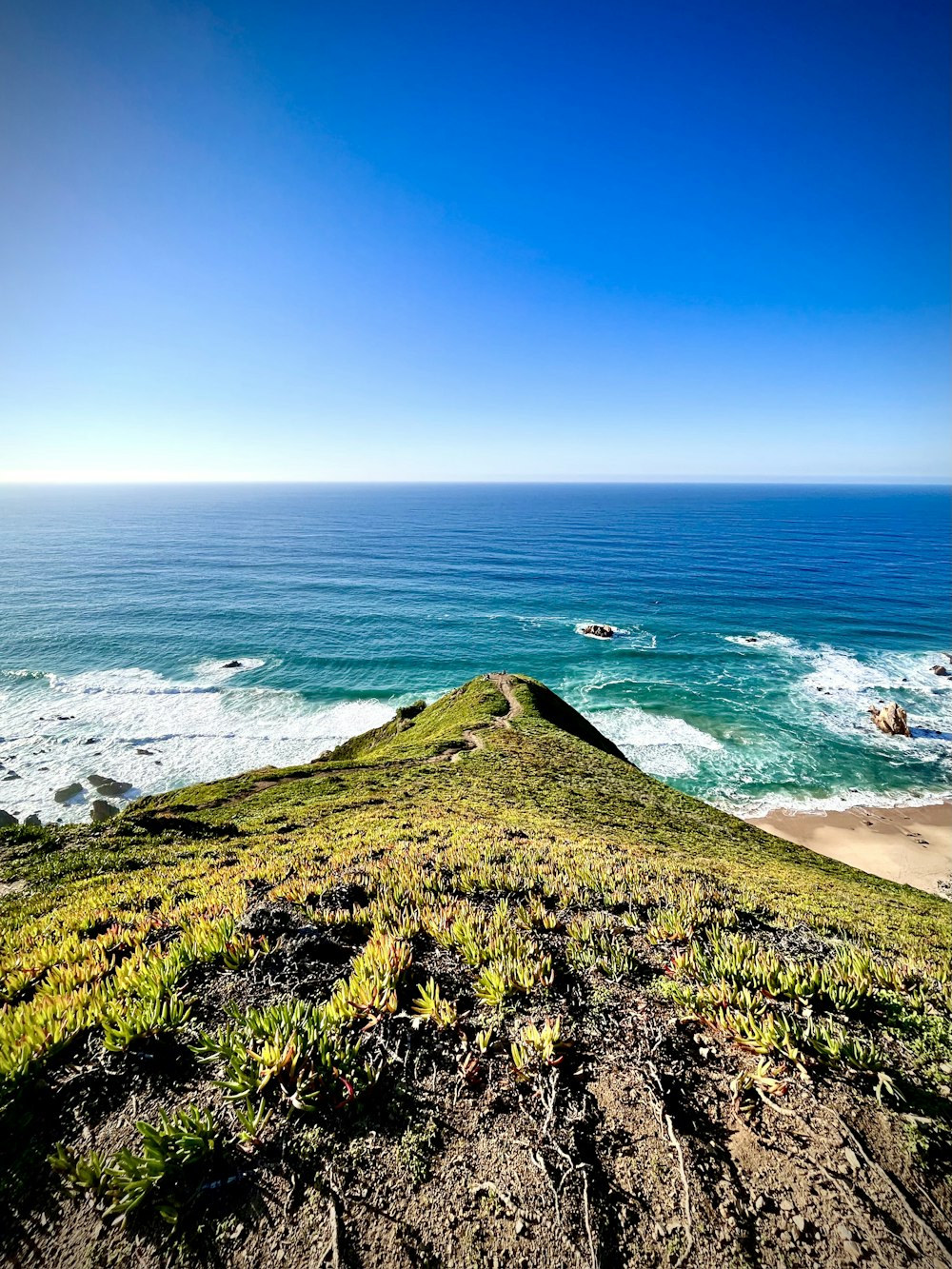 a rocky beach with waves crashing