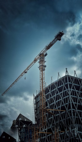 a crane next to a building