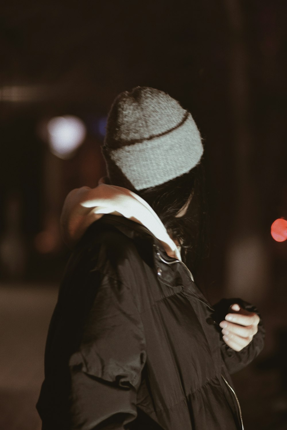 a person wearing a mask and holding a phone