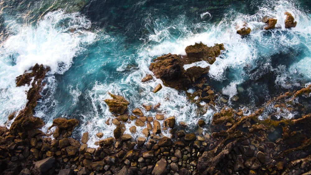 a rocky beach with waves crashing