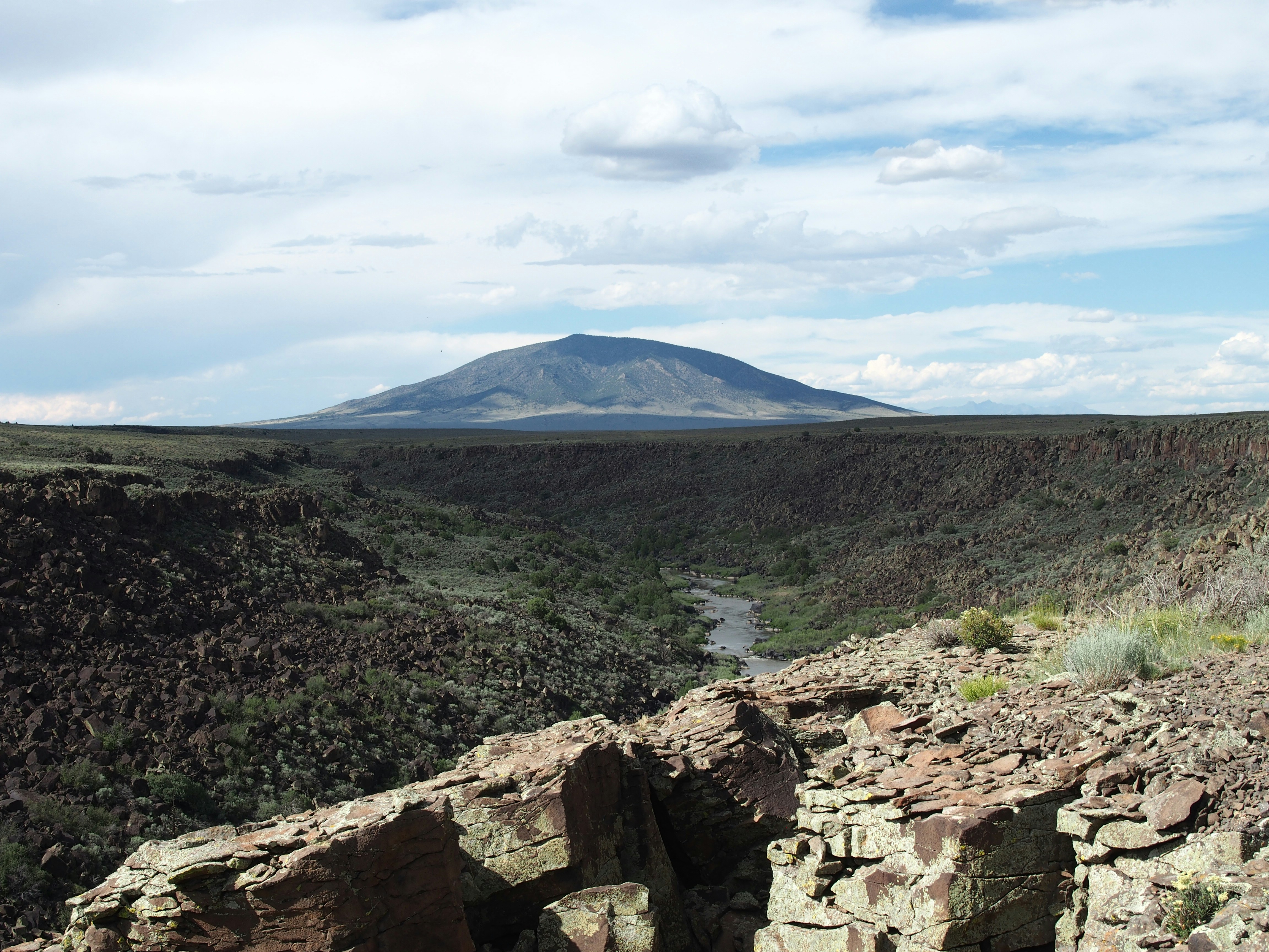 a rocky landscape with a river running through it