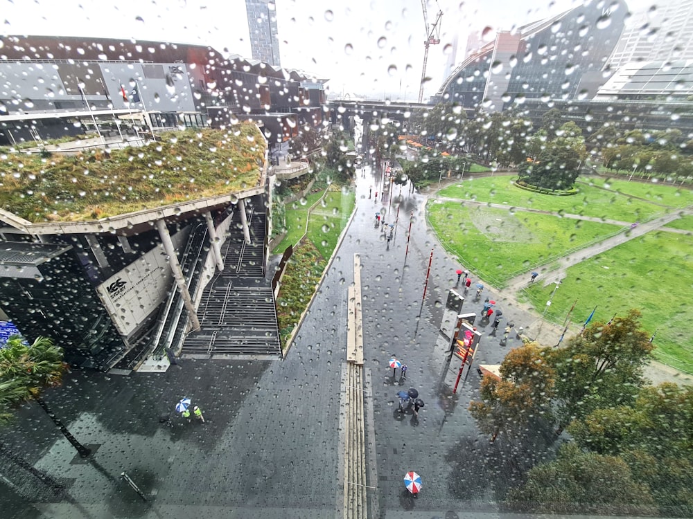 a group of people walking on a bridge over a river