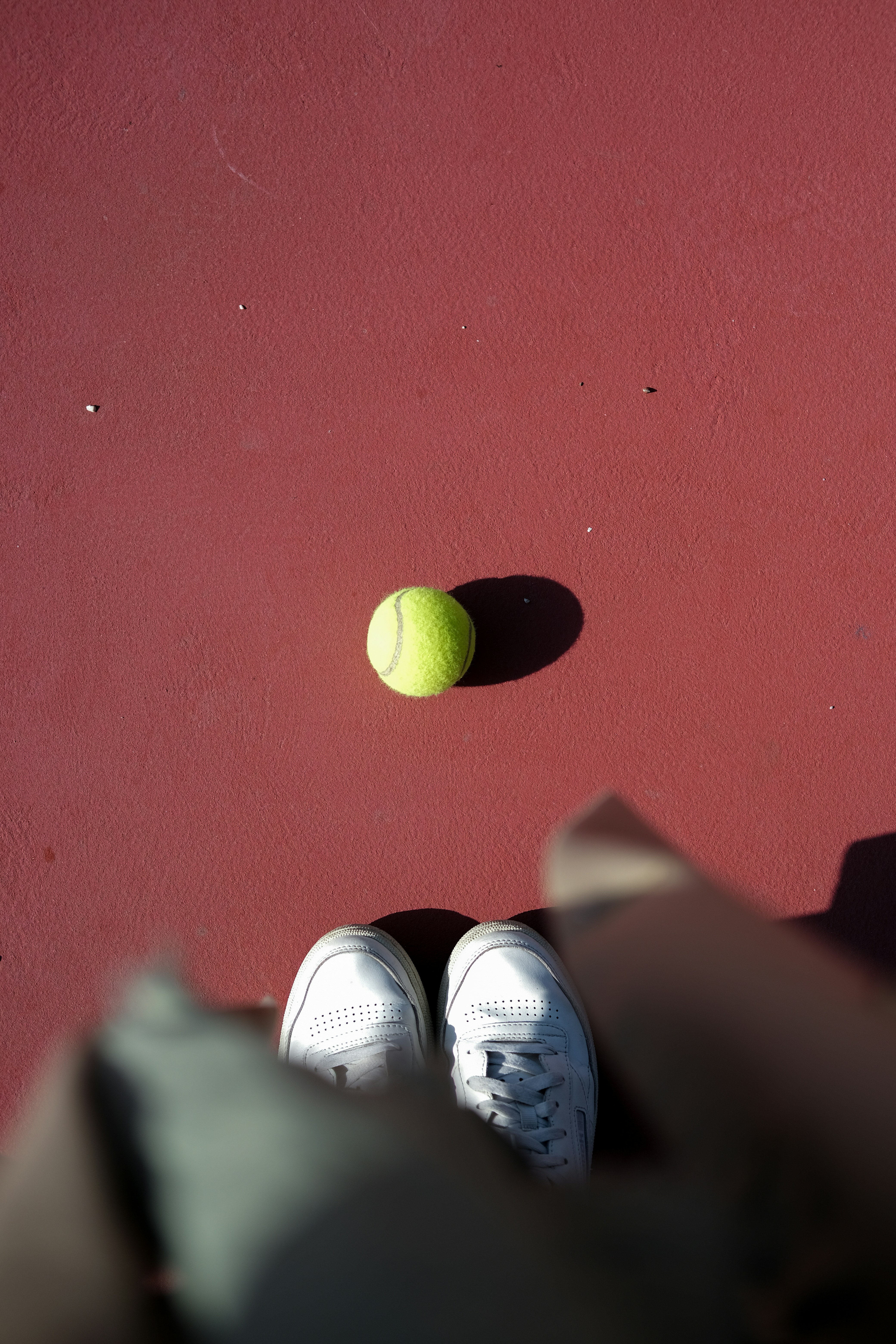 a person holding a couple of balls
