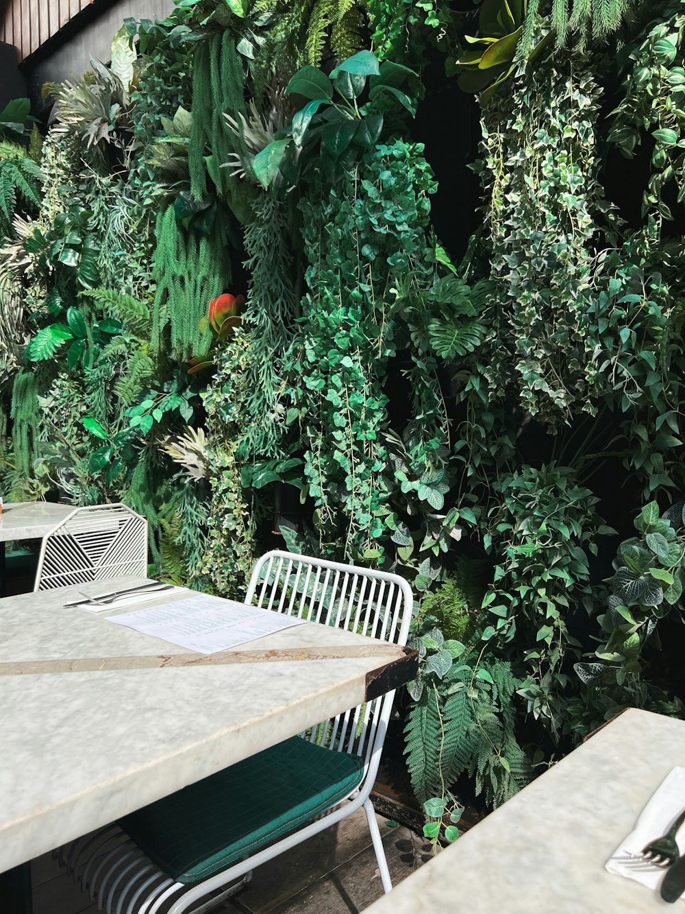 a table and chairs in a garden