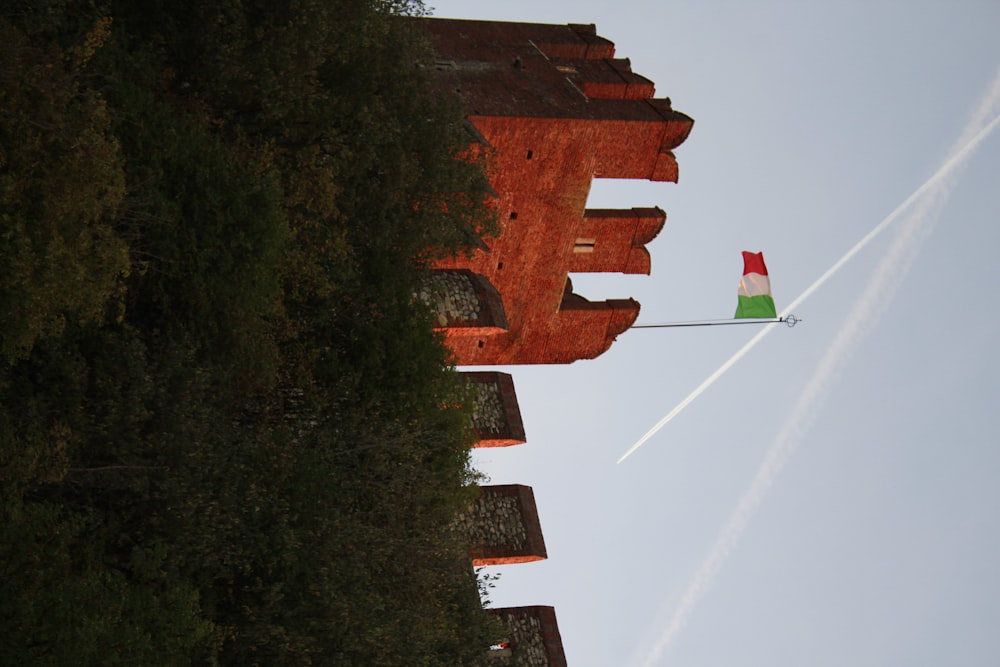a flag flying in front of a castle