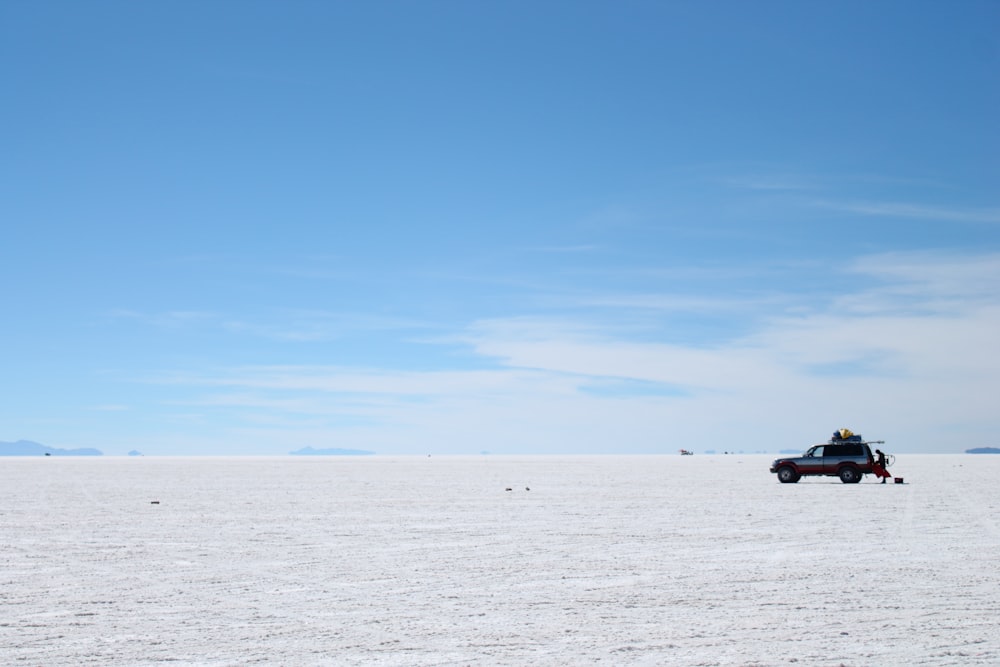 a car driving through a desert