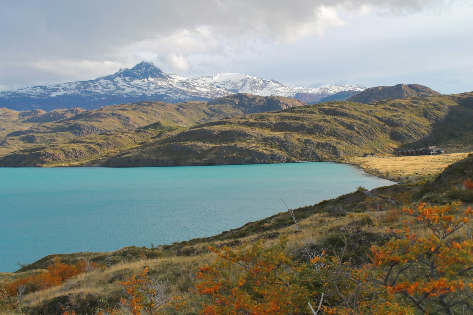 Turquoise Patagonian lake under gathering clouds — typical of the wind patterns that define Bariloche weather