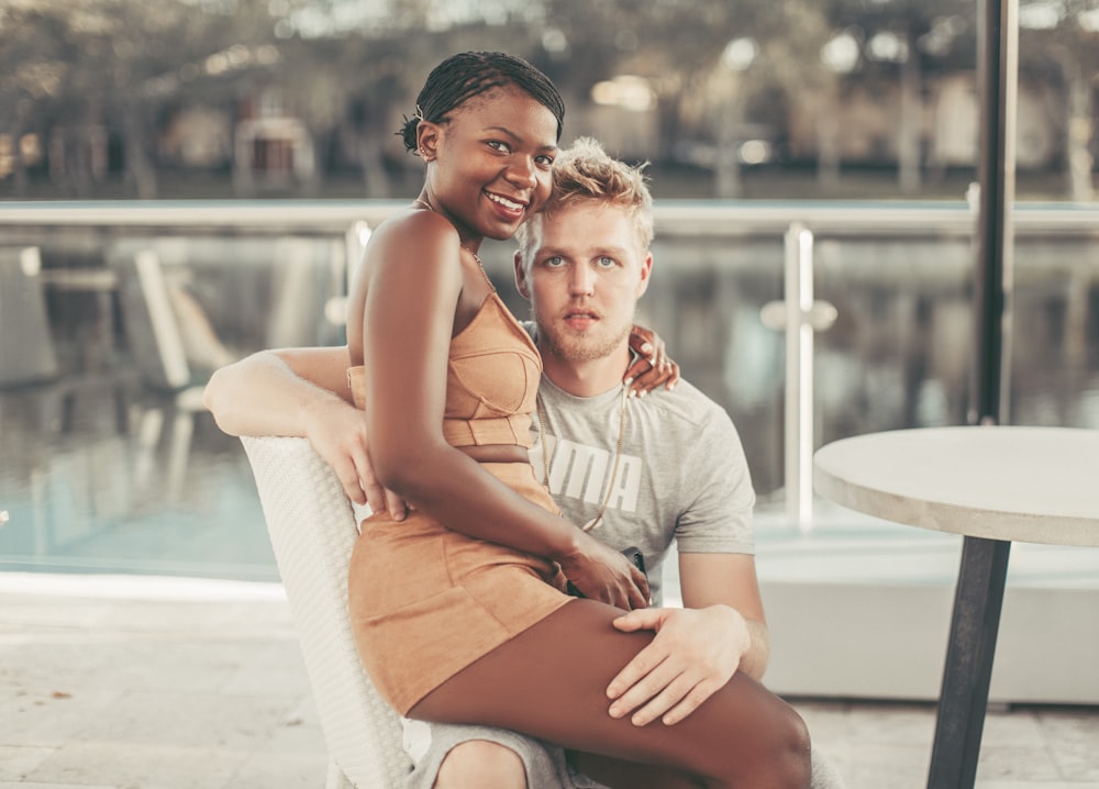 a man and woman sitting on a bench