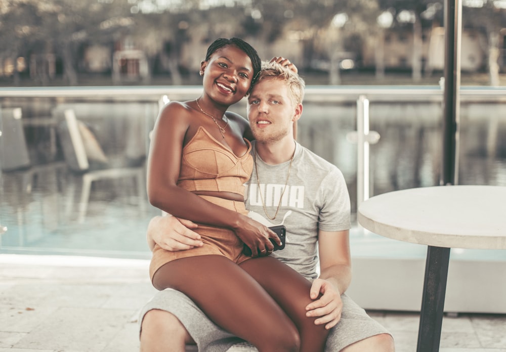 a man and woman sitting on a table