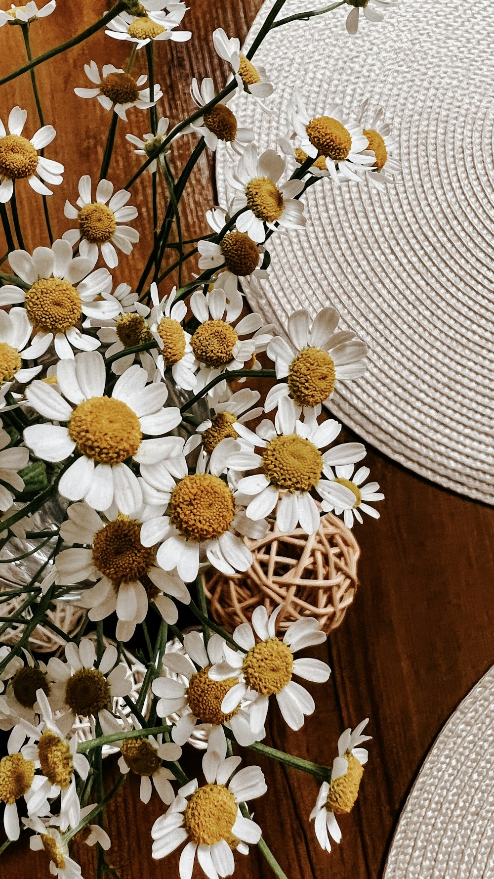a basket of white and yellow flowers