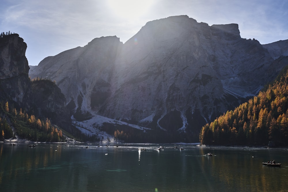 a body of water with mountains in the back