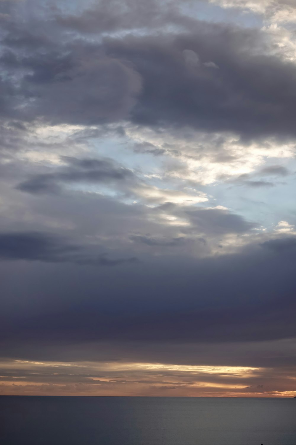 a cloudy sky over water