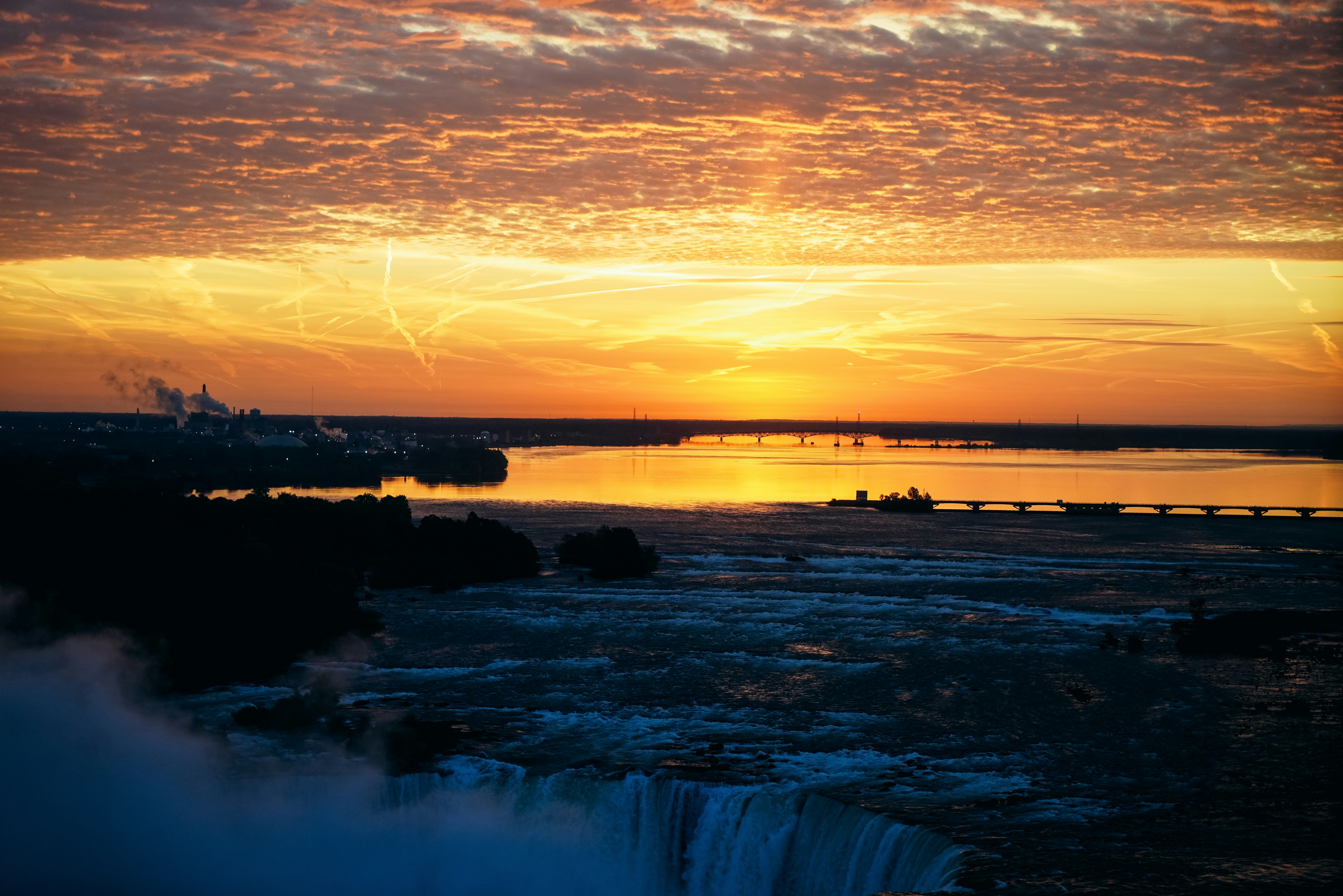 a sunset over a body of water