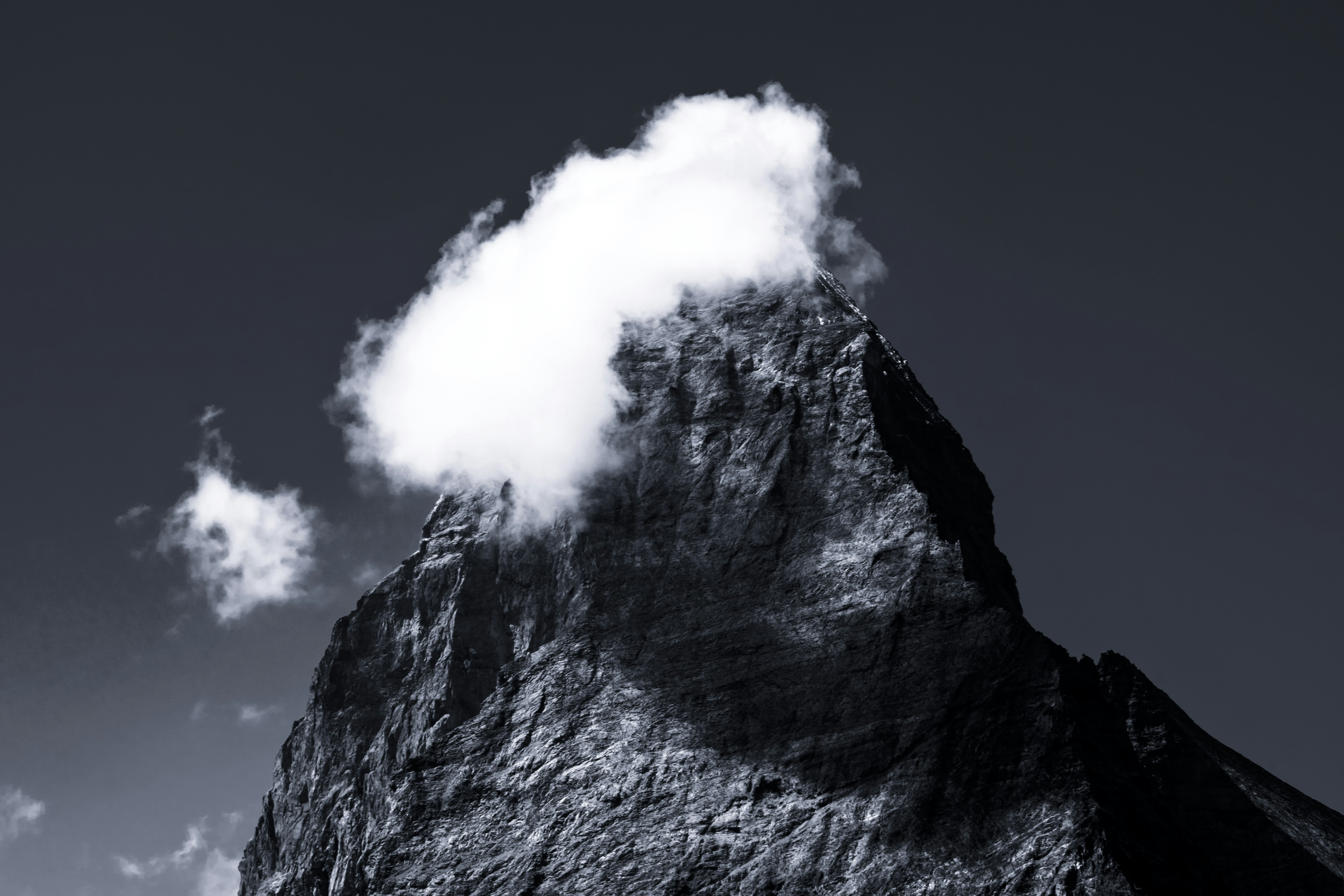 a mountain with a cloud of smoke