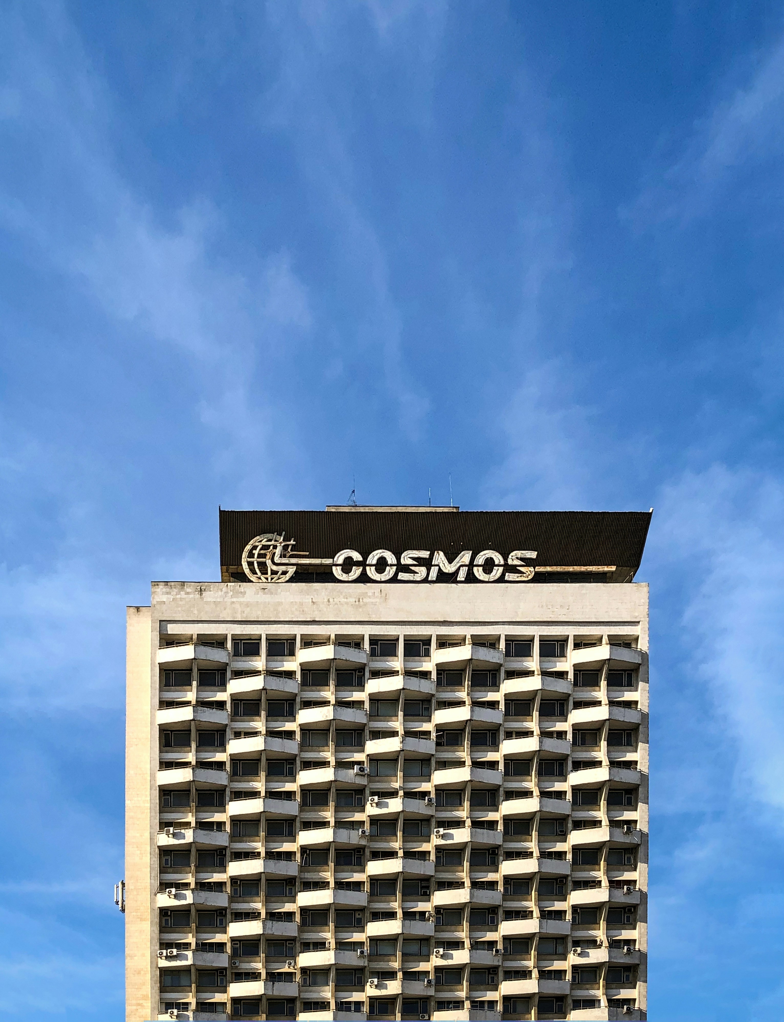 a tall building with a sign on it