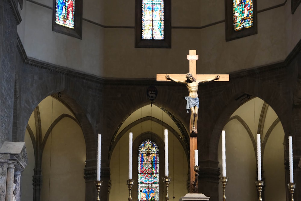 a cross on a pole in a church