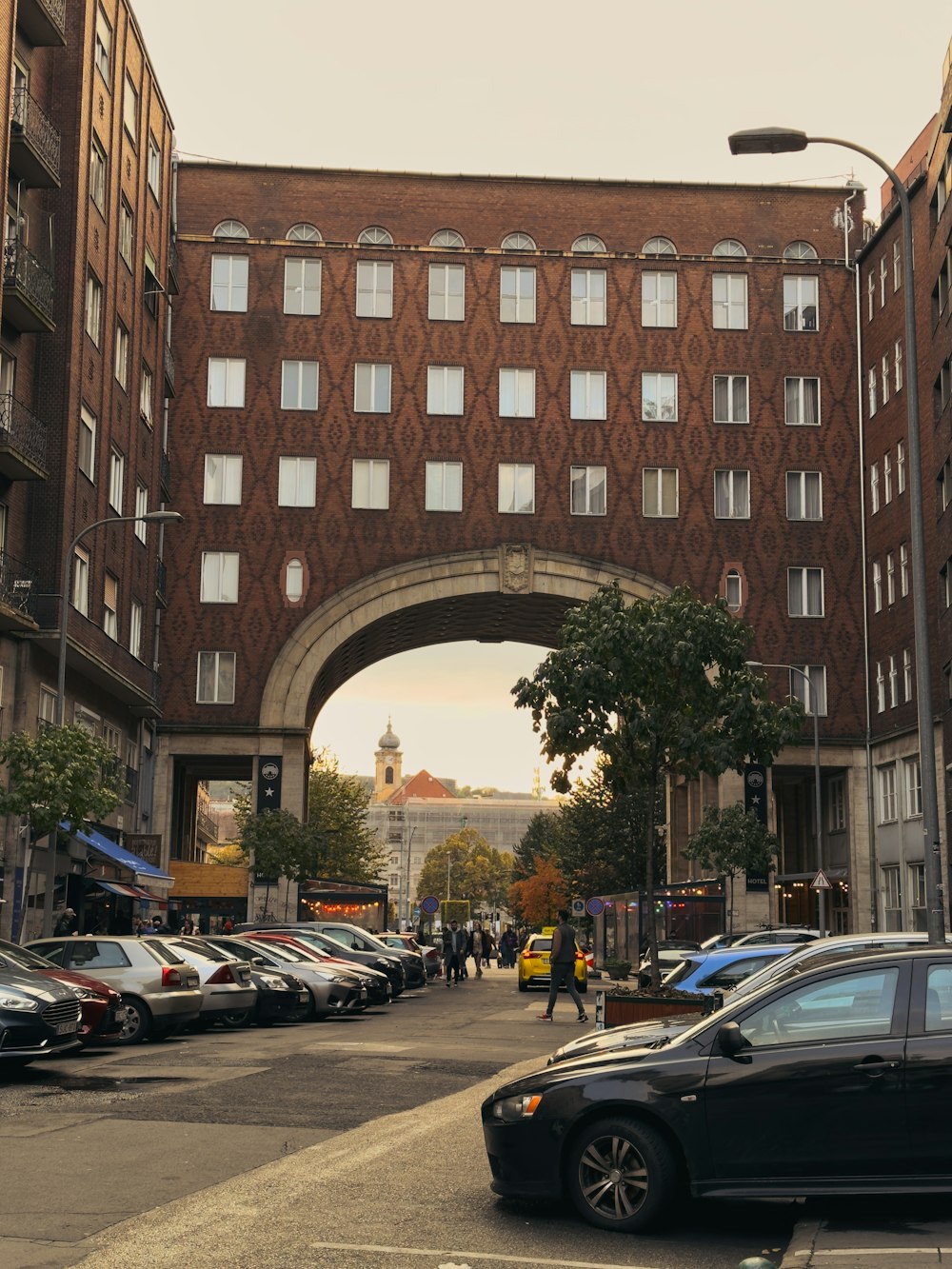 a street with cars and buildings on either side of it