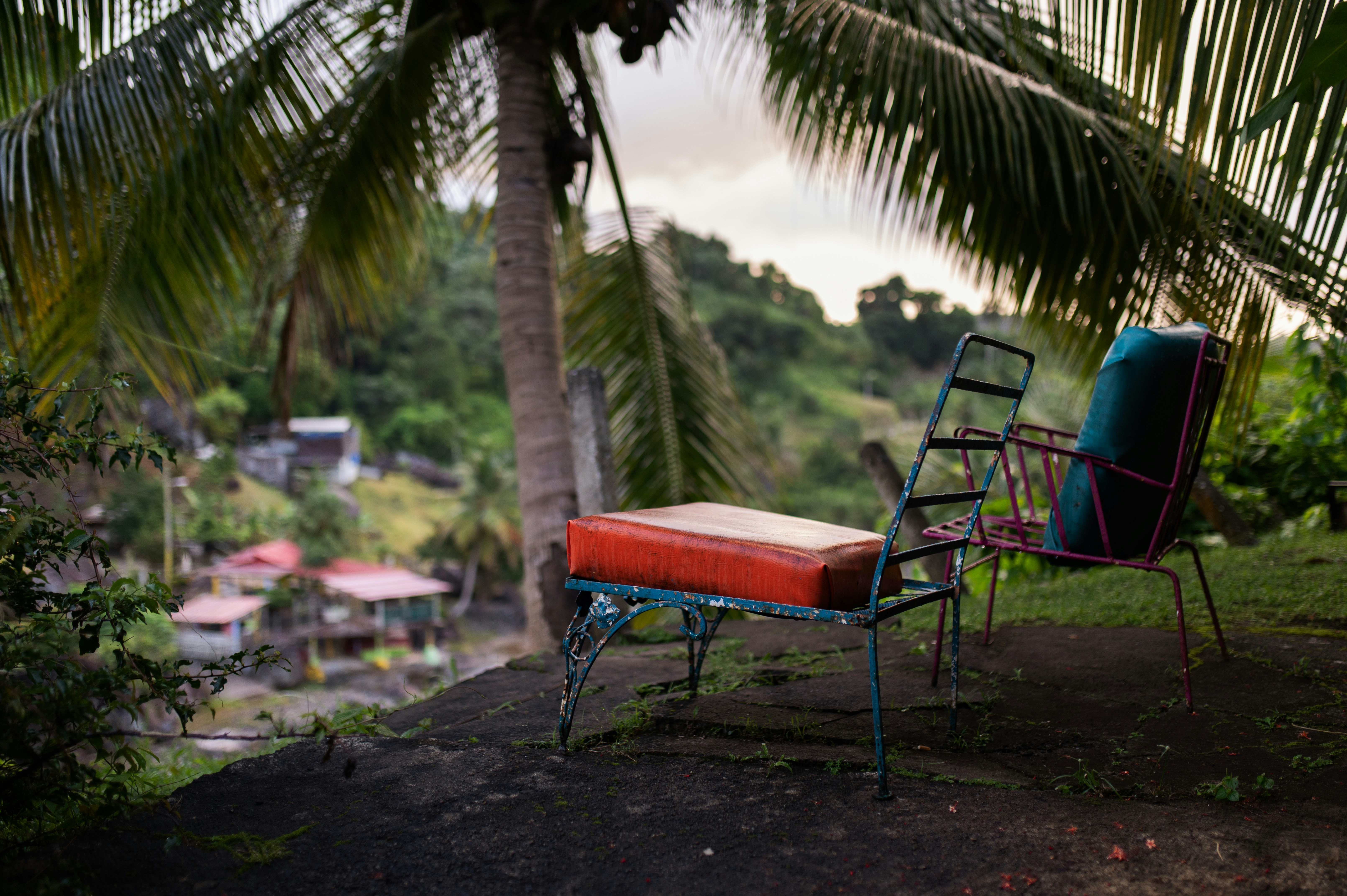 a couple of chairs sit near each other - El Yunque